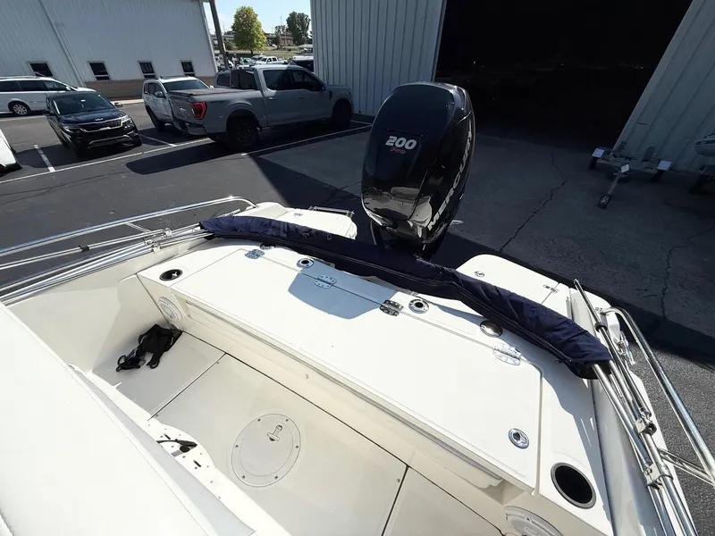Slide: The Image of 2016 Boston Whaler 210 Dauntless boat with Mercury 200 engine in parking lot. - 5