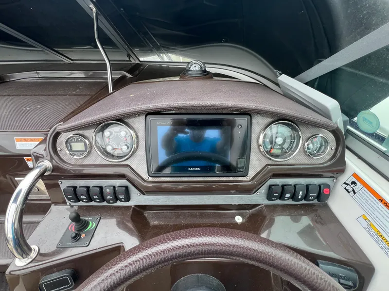Slide: The Image of Dashboard of a 2015 Regal 28 Express boat with Garmin navigation system. - 14