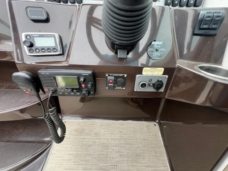 Slide: The Image of Control panel of a 2015 Regal 28 Express boat with various instruments. - 15