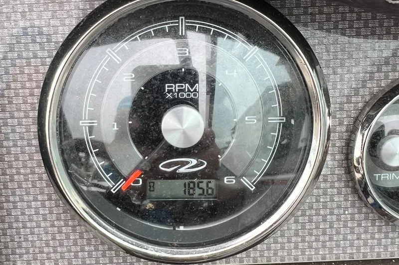 Slide: The Image of Close-up of a 2015 Regal 28 Express RPM gauge displaying 1856 RPM. - 28