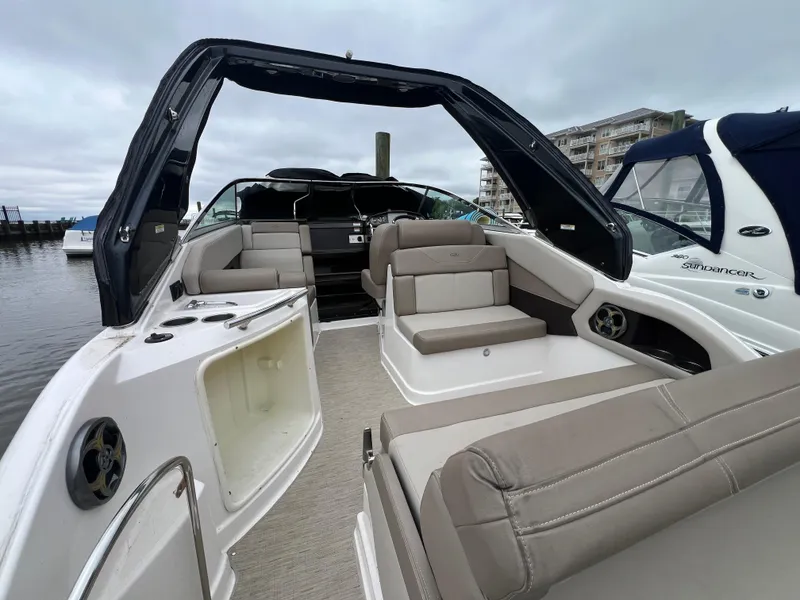 Slide: The Image of 2015 Regal 28 Express boat interior with seating, docked at marina. - 5