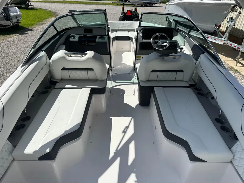 Slide: The Image of 2024 Regal LX4 boat interior with white seating and modern dashboard design. - 5