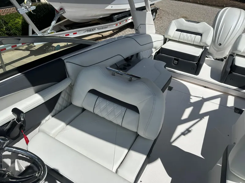 Slide: The Image of 2024 Regal LX4 boat interior with luxurious white seating and modern design. - 6