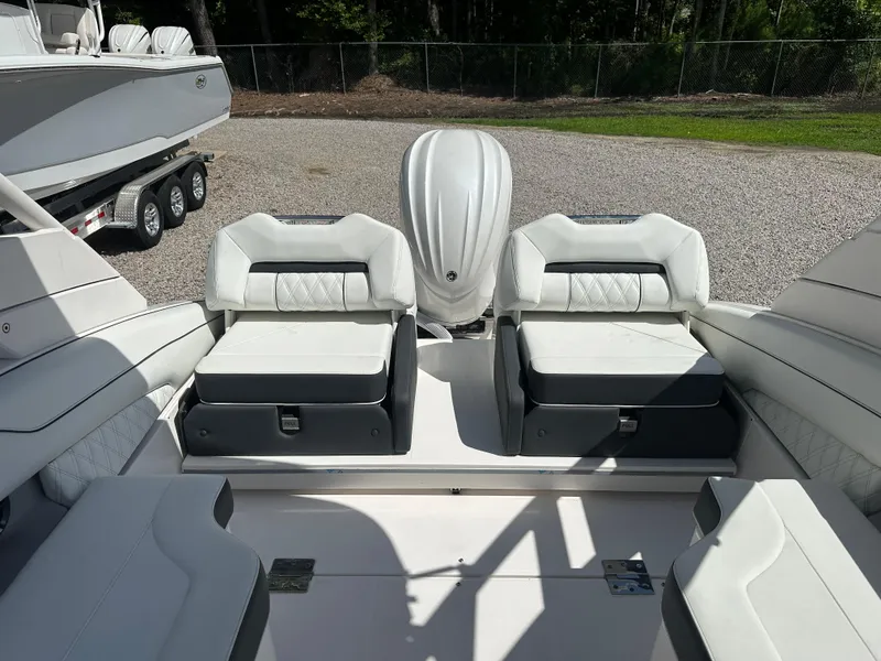 Slide: The Image of 2024 Regal LX4 boat interior with white seating and modern design. - 7
