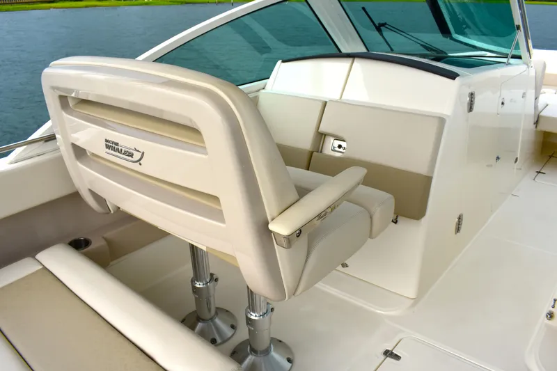 Slide: The Image of 2023 Boston Whaler 320 Vantage boat interior with helm seat and console. - 16