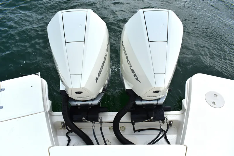 Slide: The Image of 2023 Boston Whaler 320 Vantage with dual Mercury outboard engines on water. - 31