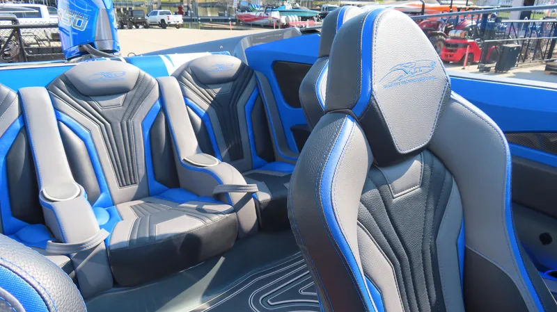 Slide: The Image of 2023 MTI 390X boat interior with blue and gray seating. - 20