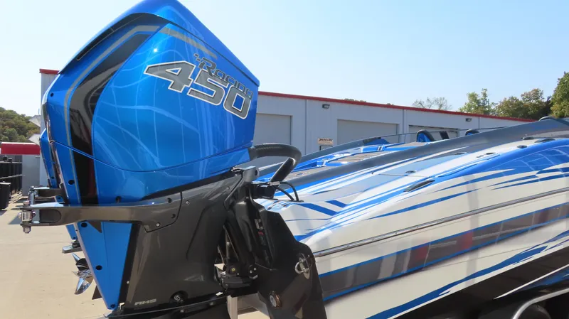 Slide: The Image of 2023 MTI 390X boat with blue Mercury 450R outboard engine. - 7