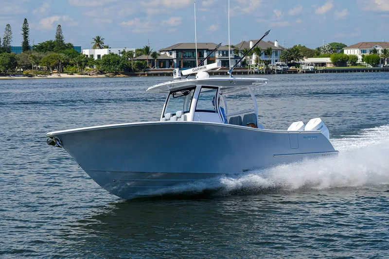 Slide: The Image of 2026 Phenom 34 Center Console boat cruising on a sunny day. - 10