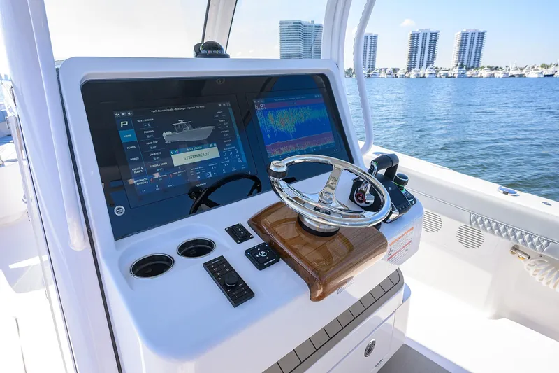 Slide: The Image of 2026 Phenom 34 Center Console boat dashboard with advanced navigation system. - 16