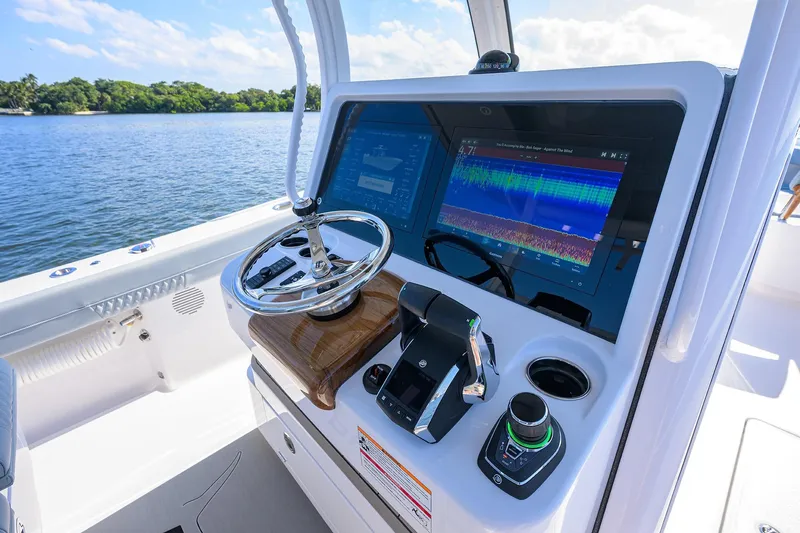 Slide: The Image of 2026 Phenom 34 Center Console boat dashboard with advanced navigation system. - 17