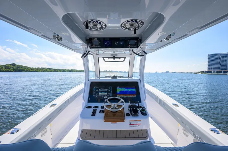 Slide: The Image of 2026 Phenom 34 Center Console boat interior with advanced navigation system on open water. - 18