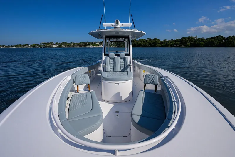 Slide: The Image of 2026 Phenom 34 Center Console boat on calm water, featuring sleek design and comfortable seating. - 19