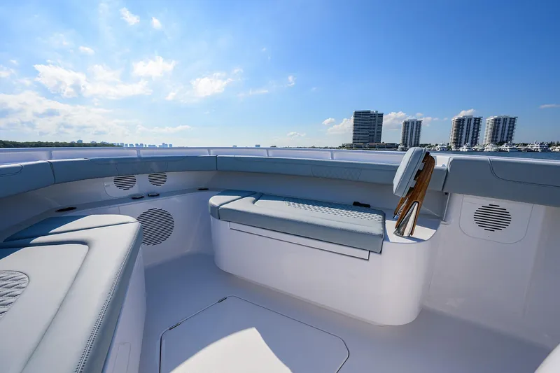 Slide: The Image of 2026 Phenom 34 Center Console boat interior with luxurious seating and city skyline view. - 23