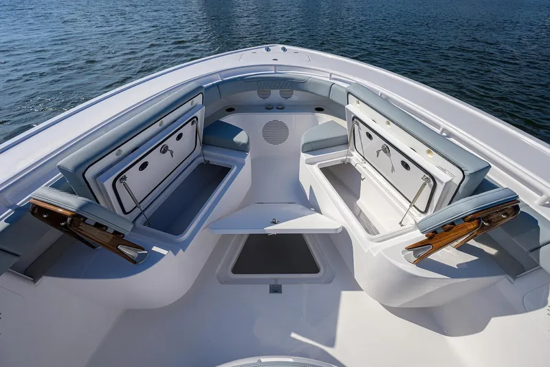 Slide: The Image of 2026 Phenom 34 Center Console boat interior with open storage compartments on the water. - 26