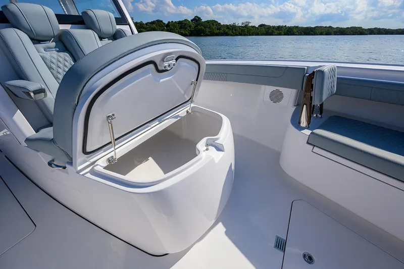 Slide: The Image of 2026 Phenom 34 Center Console boat interior with open storage compartment and seating. - 30