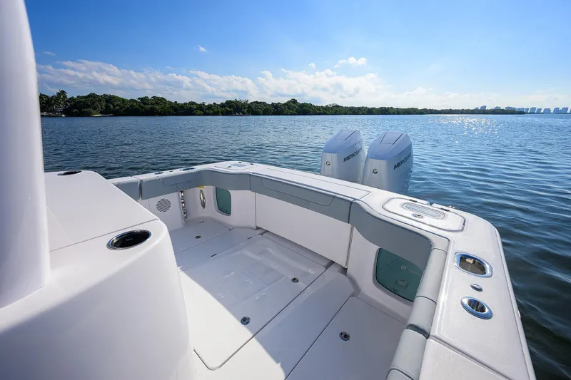 Slide: The Image of 2026 Phenom 34 Center Console boat on calm water, featuring dual Mercury engines. - 31