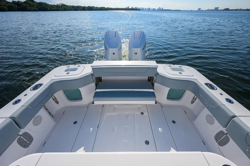 Slide: The Image of 2026 Phenom 34 Center Console boat on open water, featuring spacious deck and dual engines. - 34