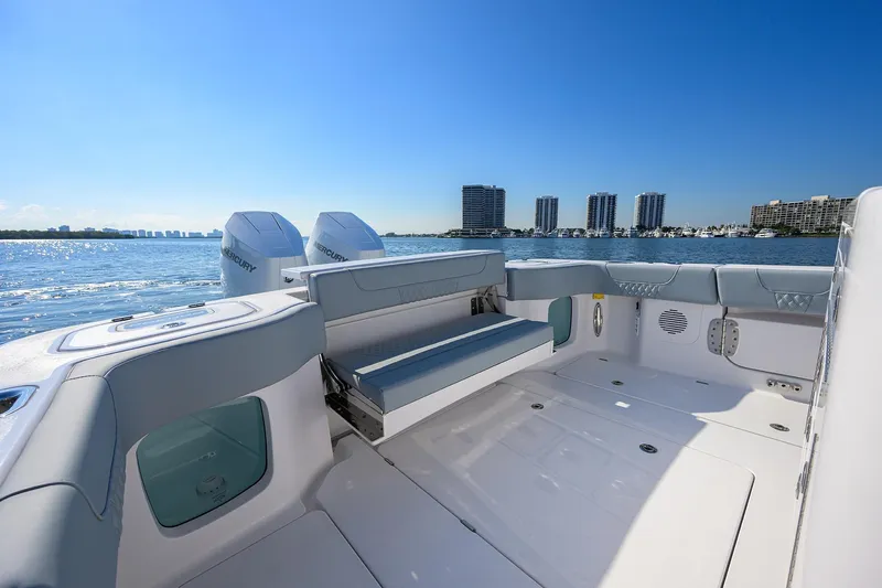 Slide: The Image of 2026 Phenom 34 Center Console boat interior with dual Mercury engines, overlooking waterfront skyline. - 35