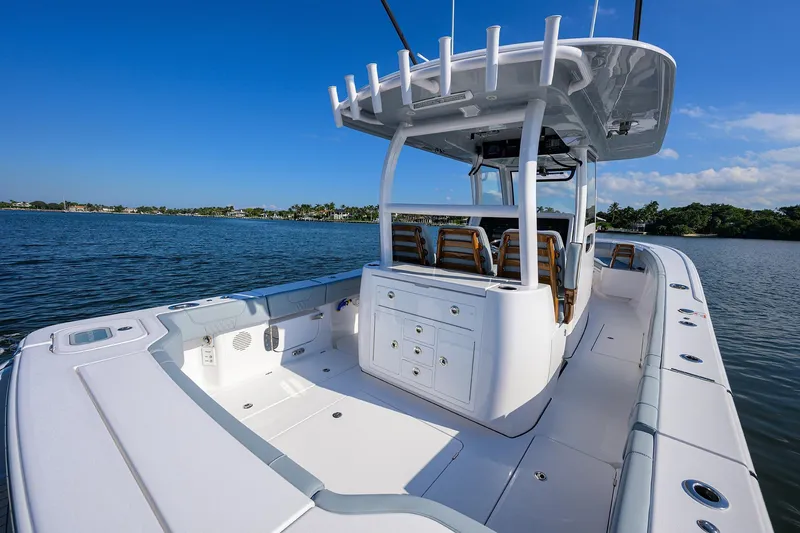 Slide: The Image of 2026 Phenom 34 Center Console boat on calm water, featuring spacious deck and seating. - 43