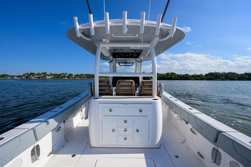 Slide: The Image of 2026 Phenom 34 Center Console boat on calm water under clear blue sky. - 45