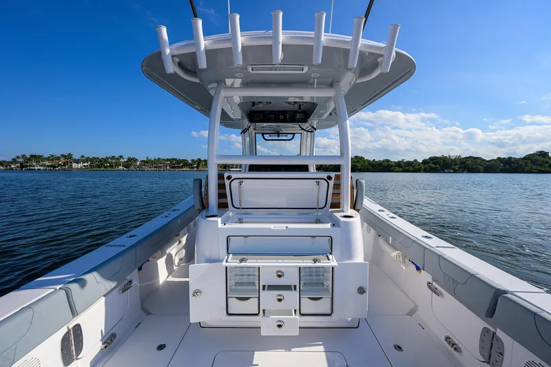 Slide: The Image of 2026 Phenom 34 Center Console boat on calm water under clear blue sky. - 47