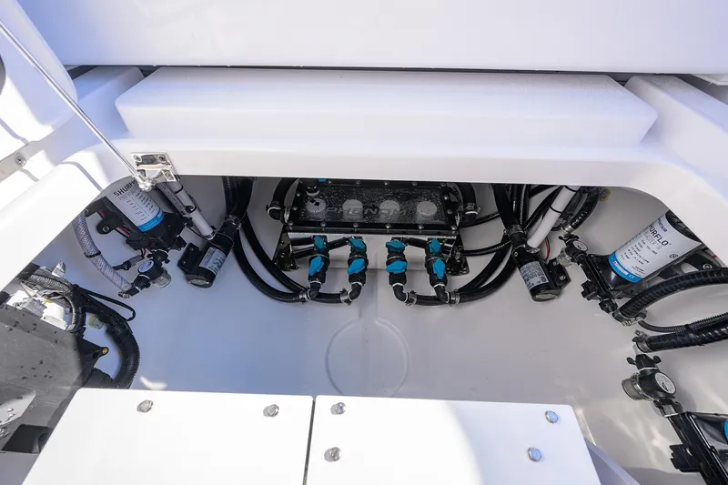 Slide: The Image of 2026 Phenom 34 Center Console boat engine compartment with wiring and components. - 50