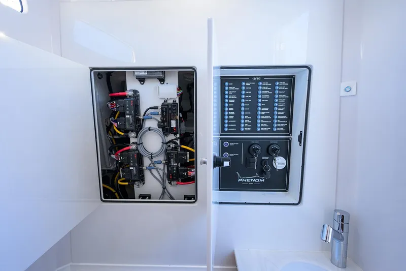 Slide: The Image of Electrical panel of 2026 Phenom 34 Center Console boat, showcasing wiring and controls. - 53