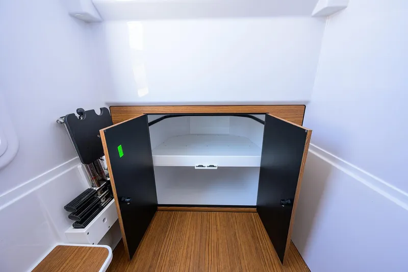 Slide: The Image of Interior storage compartment of 2026 Phenom 34 Center Console boat. - 54