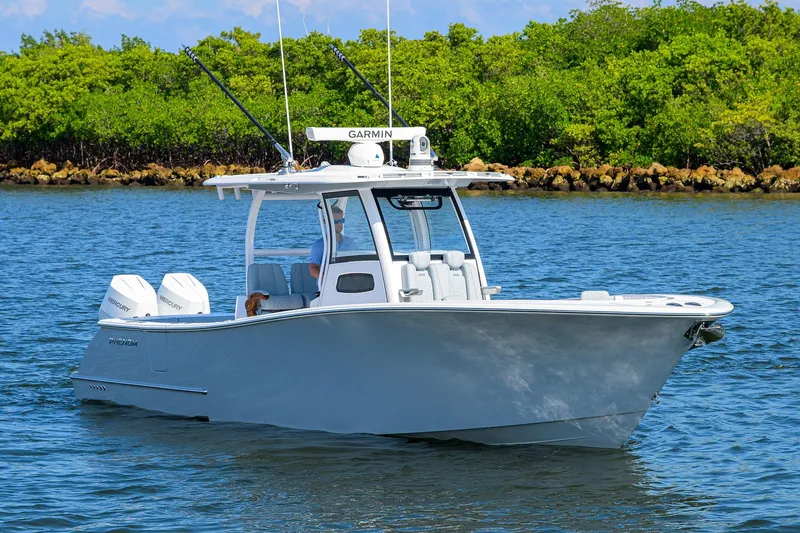 Slide: The Image of 2026 Phenom 34 Center Console boat on water, featuring dual Mercury engines. - 7
