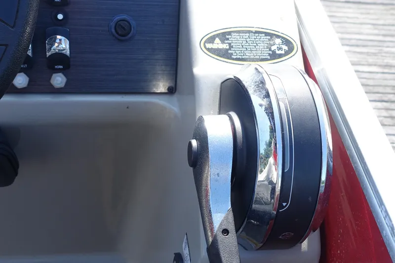 Slide: The Image of Control panel of 2018 Cypress Cay Seabreeze 212 boat with throttle lever and warning label. - 4