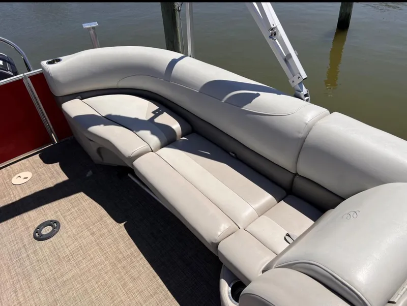 Slide: The Image of Luxurious seating on 2018 Cypress Cay Seabreeze 212 pontoon boat, docked by water. - 5