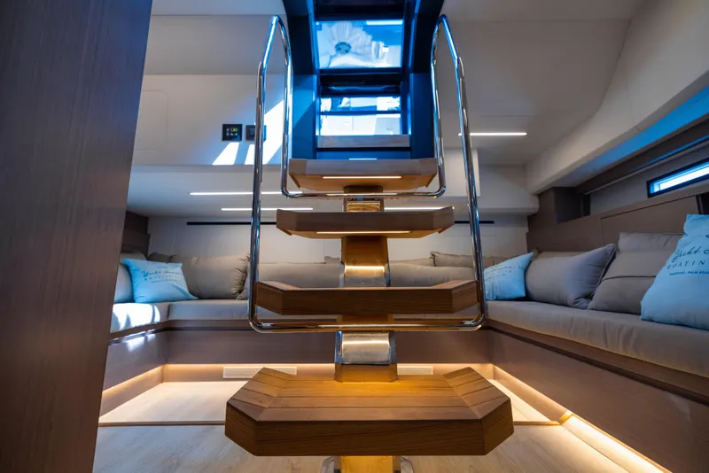 Slide: The Image of Luxurious interior of 2023 OKEAN 57 yacht with modern staircase and cozy seating area. - 10