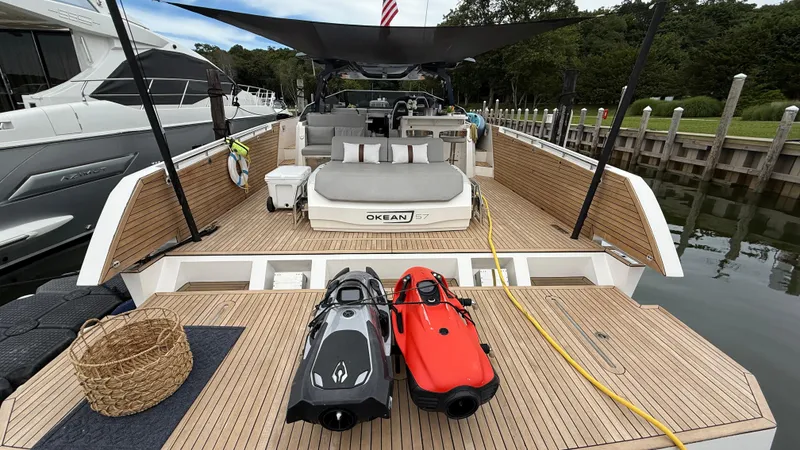 Slide: The Image of Luxury 2023 OKEAN 57 yacht with spacious deck and modern amenities docked at marina. - 17