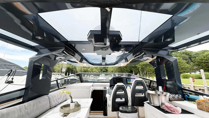 Slide: The Image of Luxurious interior of 2023 OKEAN 57 yacht with modern seating and panoramic windows. - 18