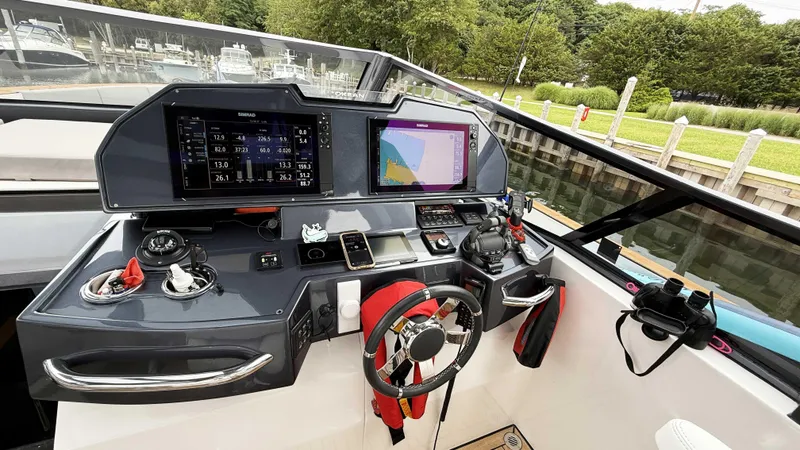 Slide: The Image of Helm of 2023 OKEAN 57 yacht with advanced navigation systems and controls. - 24