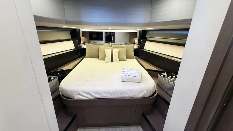 Slide: The Image of Luxurious bedroom interior of 2023 OKEAN 57 yacht with elegant bedding and modern design. - 26