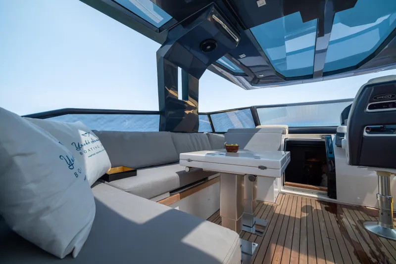 Slide: The Image of Luxurious interior of 2023 OKEAN 57 yacht with modern seating and panoramic views. - 6