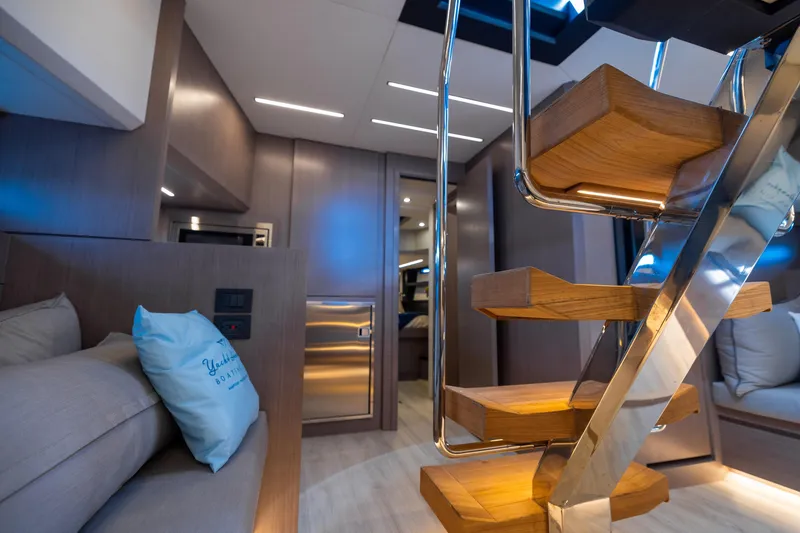 Slide: The Image of Luxurious interior of 2023 OKEAN 57 yacht with modern staircase and elegant furnishings. - 7