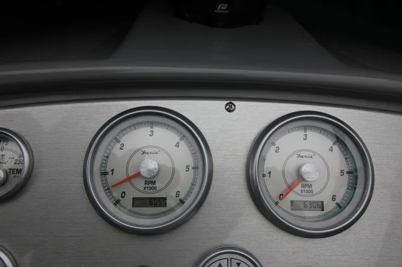 Slide: The Image of Dashboard gauges of a 2006 Cruisers Yachts 320 Express, displaying RPM readings. - 14