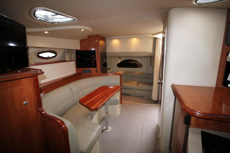 Slide: The Image of Luxurious interior of 2006 Cruisers Yachts 320 Express with elegant seating and wood finishes. - 15