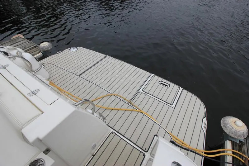 Slide: The Image of 2006 Cruisers Yachts 320 Express swim platform with dockside view. - 2