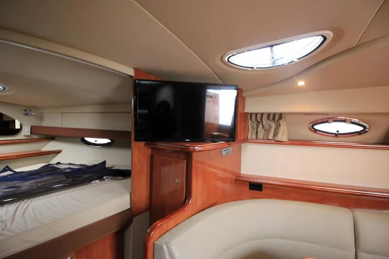 Slide: The Image of Interior of 2006 Cruisers Yachts 320 Express with TV and cozy seating area. - 25