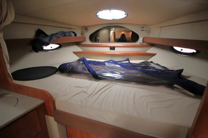 Slide: The Image of Interior cabin of 2006 Cruisers Yachts 320 Express with bed and storage. - 27