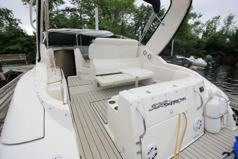 Slide: The Image of 2006 Cruisers Yachts 320 Express boat interior with seating and deck view. - 5