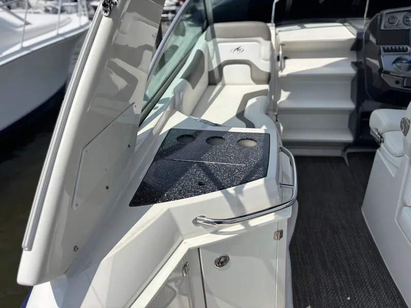 Slide: The Image of 2013 Monterey 280 SCR boat interior with seating and control panel. - 13