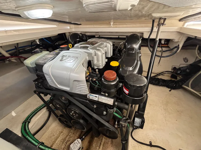 Slide: The Image of Engine compartment of a 2013 Monterey 280 SCR boat, featuring a Big Block V8 engine. - 24