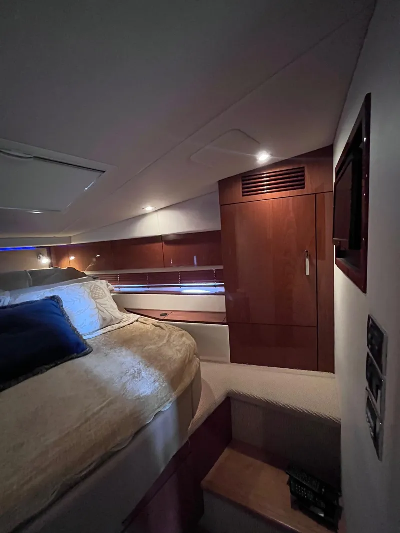 Slide: The Image of Luxurious cabin interior of 2013 Sea Ray 450 Sundancer yacht with cozy bedding. - 11