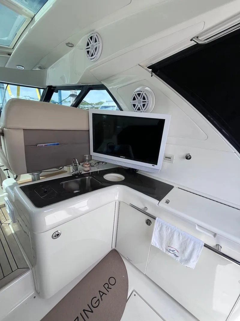 Slide: The Image of Interior of 2013 Sea Ray 450 Sundancer yacht with TV and kitchenette. - 21