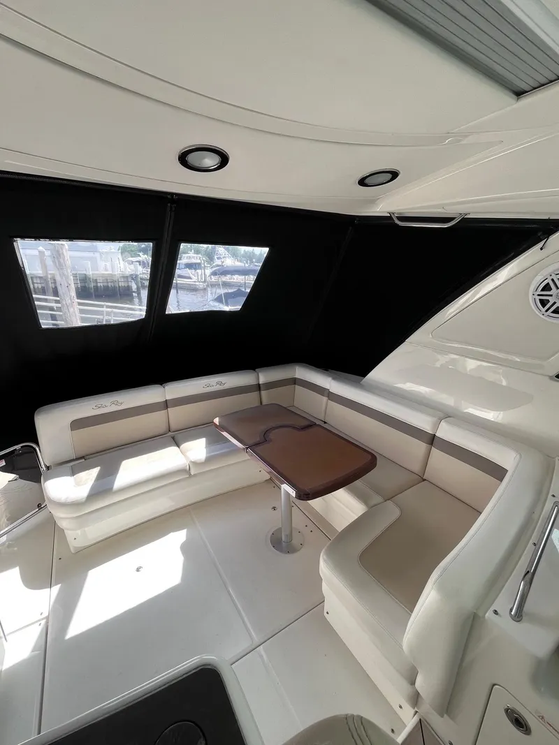 Slide: The Image of Interior of 2013 Sea Ray 450 Sundancer yacht with seating and table. - 22